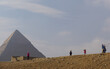 Giza, Egypt: Tourists taking selfies at the Khufu pyramid complex.