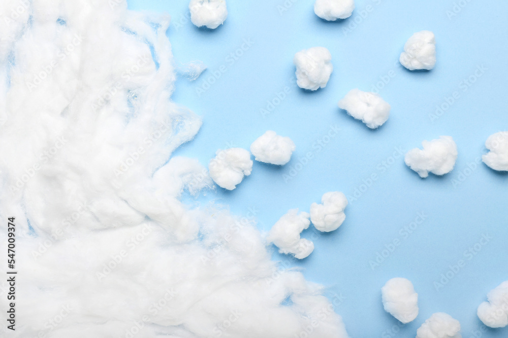 Natural cotton wool on blue background