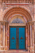 A Carved Wooden Side Door Of A Cathedral In Cuenca, Ecuador (Cataral Metropolitana De La Inmaculada Concepción）