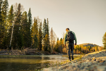 Canvas Print - Person walking in the wild in autumn 