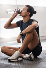 Wall Mural - Water bottle, fitness and gym man tired after a fitness training, exercise challenge and wellness goal with healthy diet or nutrition. Young sports person floor drinking water for healthy lifestyle