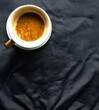 © RUS - cup of coffee on black clothing background