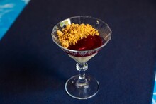 Top View Of Panna Cotta Served In A Glass With Crumbles