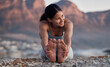 © D Theron/peopleimages.com - Fitness, yoga and stretching with a woman on the beach for wellness, mental health or exercise in nature. Environment, peace and thinking with a female athlete doing a warm up for zen training