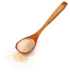 Psyllium husks in the wooden spoon, isolated on white background.