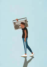 Young Man Carrying Large, Retro Boom Box, Listening To Music
