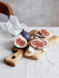© fStop - Still life fresh cut figs on cutting board