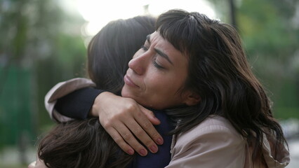 Sympathetic woman hugging friend with EMPATHY and SUPPORT. Friendship concept between two best friends