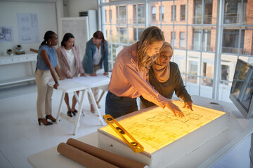 Poster - architect, business women and diversity of engineering building team planning a project. light on in