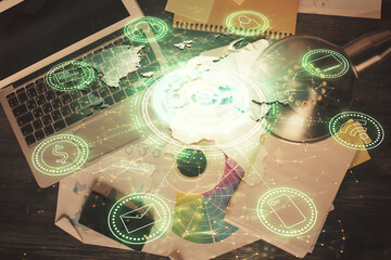 Poster - Social network hologram drawings over computer on the desktop background. Top view. Double exposure.