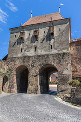 Wall Mural - Tailors Tower (Turnul Croitorilor) is one of the most beautiful and impressive towers of Sighisoara fortress due to its massiveness and simplicity. Romania (vertical shot)