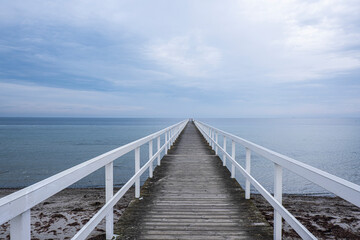  white wooden pier on the sea