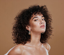Black Woman, Beauty And Skincare Face Portrait For Natural Afro, Facial Or Hair Care Cosmetics. Healthy, Beautiful And Assertive Model With Curly Hair Shine And Texture In Brown Studio Background.