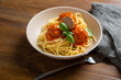 Spaghetti with meatball red tomato sauce basil leaves in bowl italian food