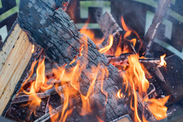 Firewood is burning beautifully in the campfire.