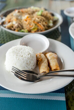 Lumpia Shanghai With Rice And Pancit Canton Guisado, Two Popular Filipino Cuisines.