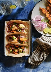 Sticker - Vertical shot of tacos with barbecued chicken on skewers