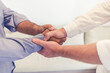© Jelena Stanojkovic - Closeup of hands of two businessmen shaking hands,making a deal, agreeing to a partnership. Two professionals greeting each other with a handshake, planning for the future in a meeting.