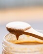 Closeup of peanut butter on wooden spoon