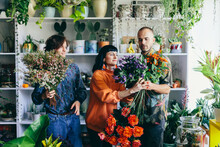 Team Of Florist Work In Flower Store With Teamwork Spirit.