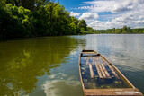 Fototapeta Na sufit - Wooden boat and the view of the backwater of Tisza
