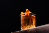 old fashioned cocktail classic bourbon whiskey and bitters, orange peel and cherry as garnish