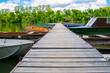 © belizar - Boats and pier on the river of Tisza