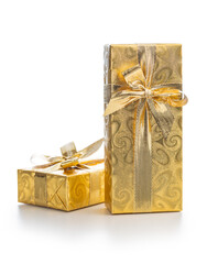 Gift wrapped in gold foil. Christmas present with gold ribbon isolated on white background.