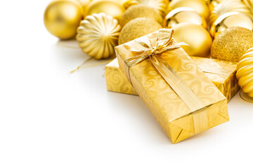 Gift wrapped in gold foil and christmas balls. Christmas decaration isolated on white background.