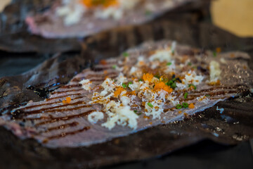 Wall Mural - Close up Wagyu Hoba Yaki beef grilled on dried leaf. Japanese food style.