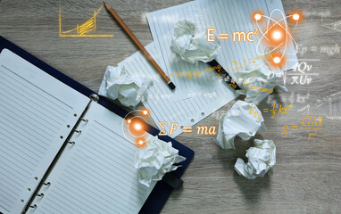 Wall Mural - notebooks and pencils and crumpled paper lay on the table with albert einstein and isaac newton's ph