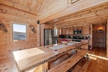 Kitchen Interior Of Log Cabin In Mountains
