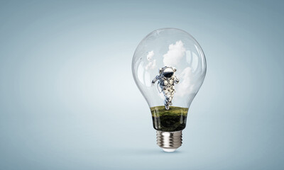 Wall Mural - spaceman inside light bulb . mixed media