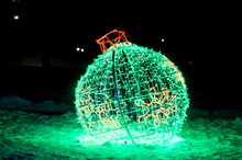 Light Installation "the Globe And Peace On Earth" Made Of A Green Garland