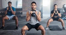Fitness, Workout And Kettlebell With A Personal Trainer In Class With A Group Of Students For Exercise. Portrait, Gym And Strong With A Coach Weight Training A Man And Woman Athlete In A Sports Club