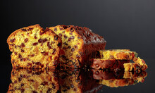 Cake With Raisins And Candied Fruit On A Black Background.