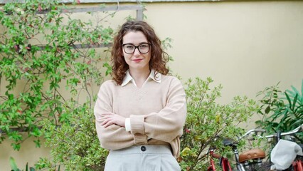 Wall Mural - Young happy pretty smiling professional business woman, happy confident positive female entrepreneur standing outdoor on street arms crossed, looking at camera, portrait.