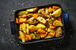 Chicken meat with pumpkin and potato. One pot baked dish. Top view image.