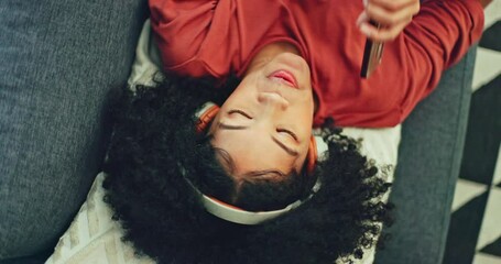 Poster - Phone, music and singing with a black woman lying on a sofa in her home on the weekend from above. Mobile, karaoke and dance with a young female having fun alone in the living room of her house