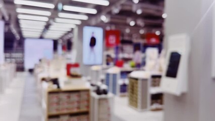 Wall Mural - Fashion, retail and shop, blurred interior view of footwear shoe store in luxury shopping mall as defocused background. High quality 4k footage