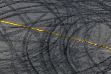 Sticker - Tire track mark on asphalt tarmac road race track texture and background, Abstract background black tire tracks skid on asphalt road in racing circuit, Tire mark skid mark on asphalt road.