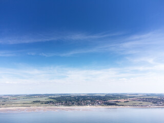  birds eye view above the sea looking at the coastline of england