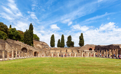 Wall Mural - Pompeii ruins view, Naples, Italy. Panorama of Quadriporticus of theatre or Gladiators Barracks