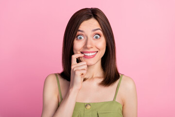 Poster - Photo of impressed brunette lady finger mouth wear khaki top isolated on pink color background