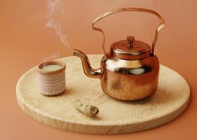 3d Rendering. Making Chai. Indian Copper Teapot With Hot Smoking Tea, Decorated Clay Tea Cup And Ginger On Round Wooden Tray. Indian Style Hot Milk Tea.