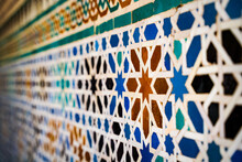 Geometric Seamless Andalusian Moroccan Islamic Arabic Star Pattern In Blue Made Out Of Ceramic Tiles In Spain Sevilla Off-focus Foreground