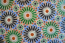 Geometric Seamless Andalusian Moroccan Islamic Arabic Round Star Floral Pattern In Green Orange Made Out Of Ceramic Tiles In Spain Sevilla