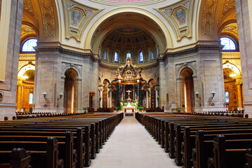 Wall Mural - An aisle between the pews leads to the altar in the Interior of St Pauls Cathedral, in St Paul Minnesota