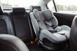 Child car seat for safety in the rear passenger seat of a car