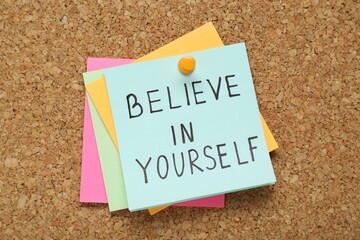 Wall Mural - Notes with phrase Believe In Yourself pinned on corkboard, top view. Motivational quote